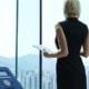Business woman standing with tablet