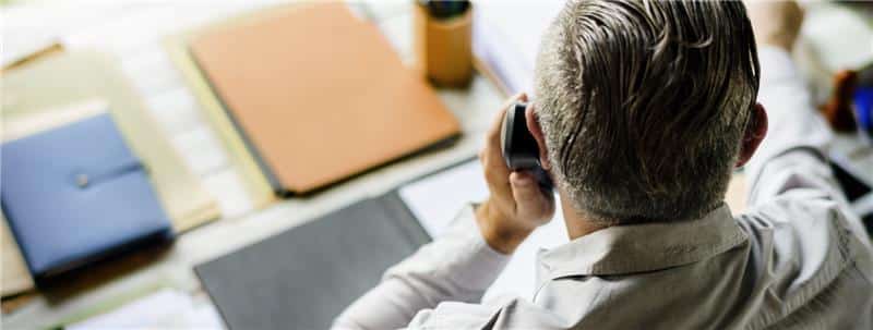 Business man on phone at a desk