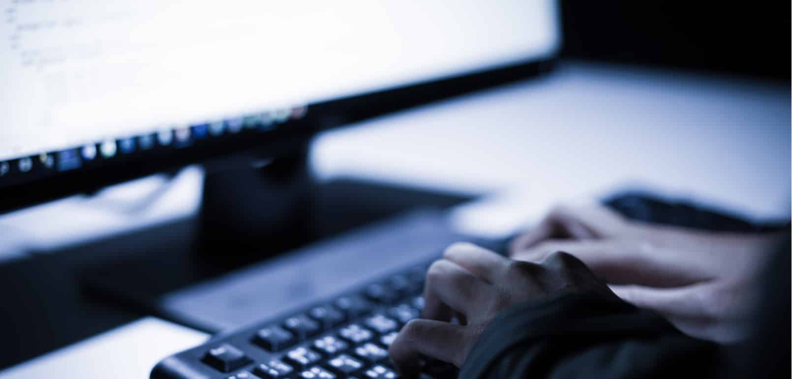 Hands typing on keyboard