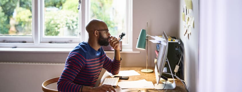 African american male working at desktop