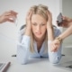 Business woman stressed with numerous people handing her papers and phones