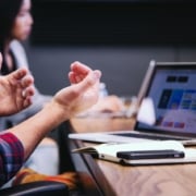 Man using laptop in meeting