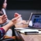 Man using laptop in meeting