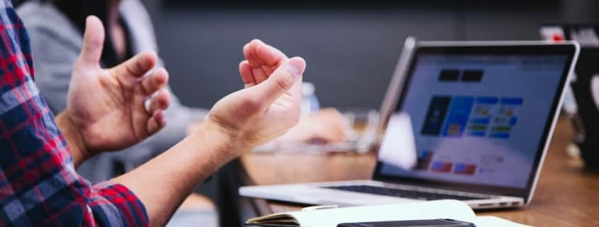 Man using laptop in meeting