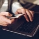 Man using laptop and cellphone
