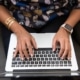 hands on a computer laptop representing endpoint protection