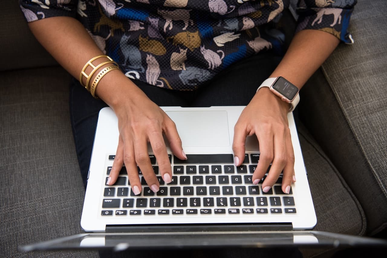 hands on a computer laptop representing endpoint protection
