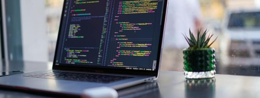 laptop on desk - SIEM as a Service