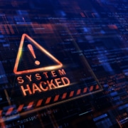 System Hacked notice with caution triangle in red