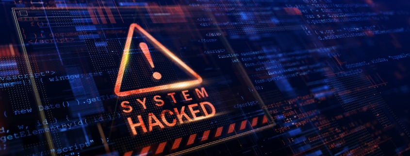 System Hacked notice with caution triangle in red
