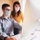 IT professionals wearing face masks