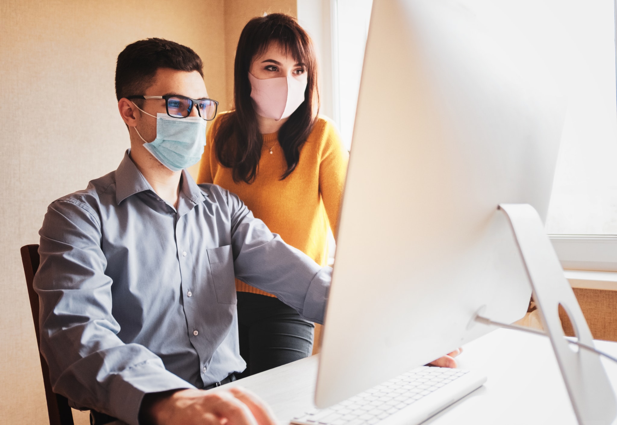 IT professionals wearing face masks